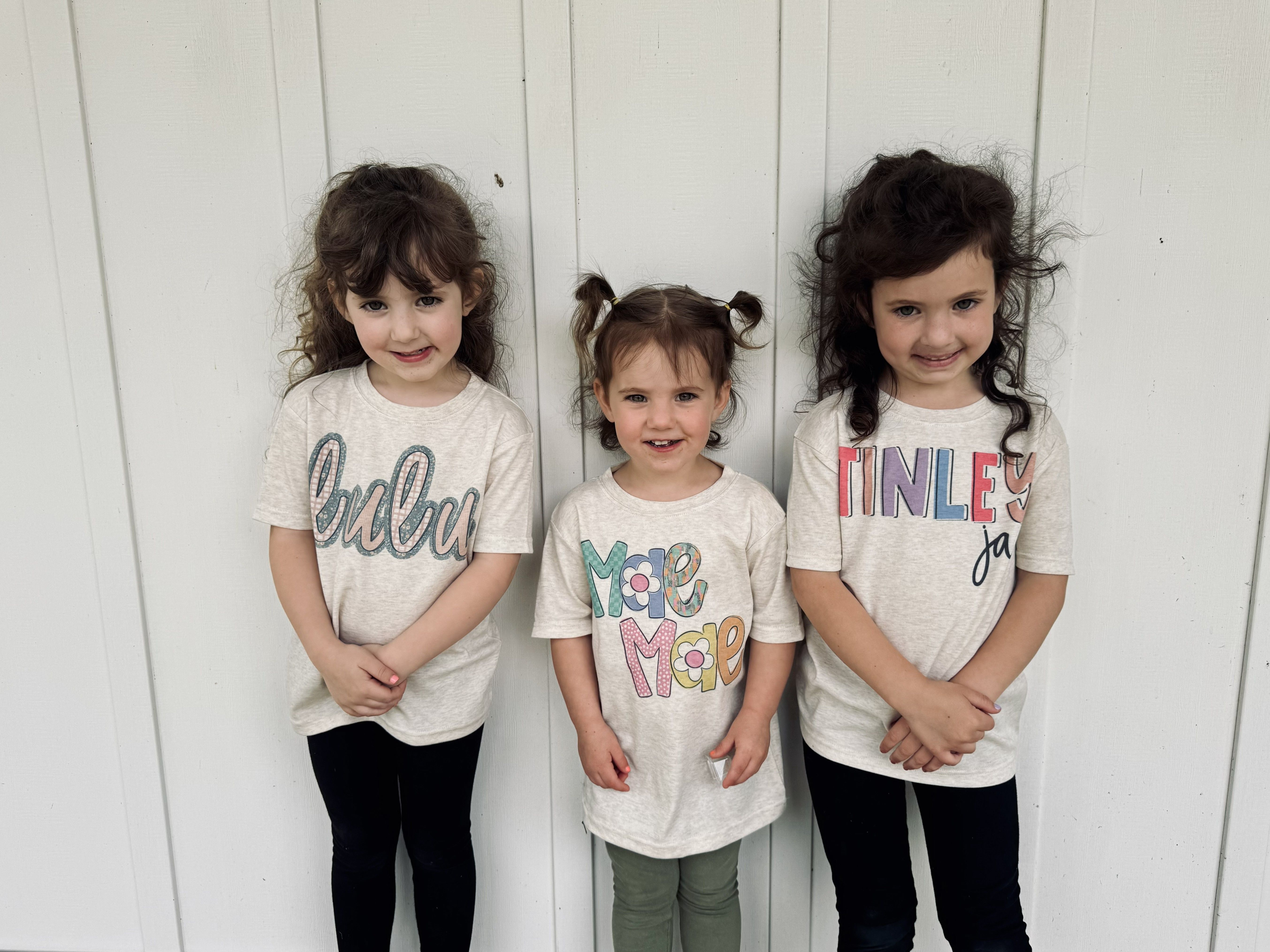 Three children in personalized Wiser Cookie Co. tees